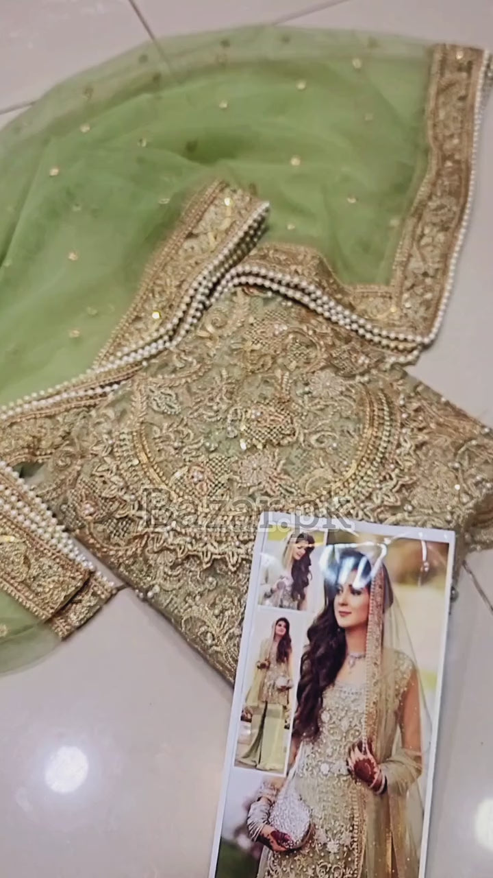 Atif Riaz Green Heavy Embroidered Net Suit